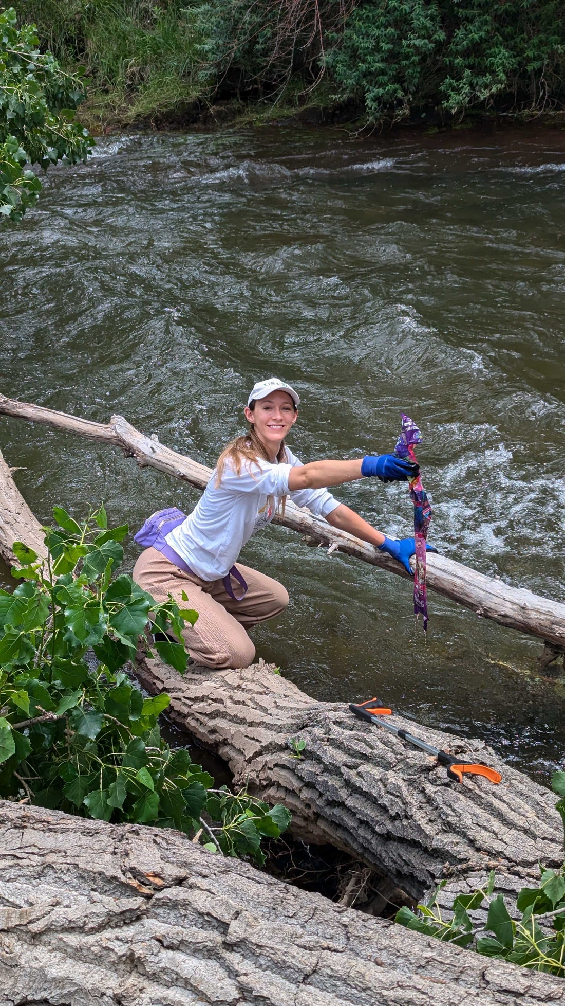 Madison pulling a full kite out of Clear Creek at Prospect Park!